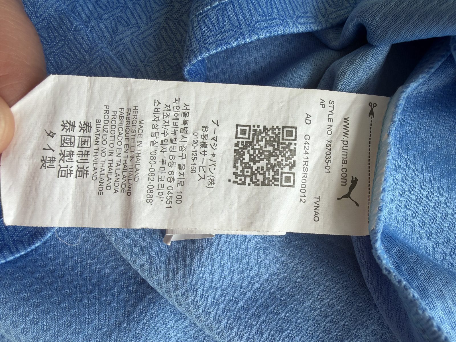 Internal neck label showing the PUMA logo, size grid, country of manufacture, QR code, and style number 757035-01