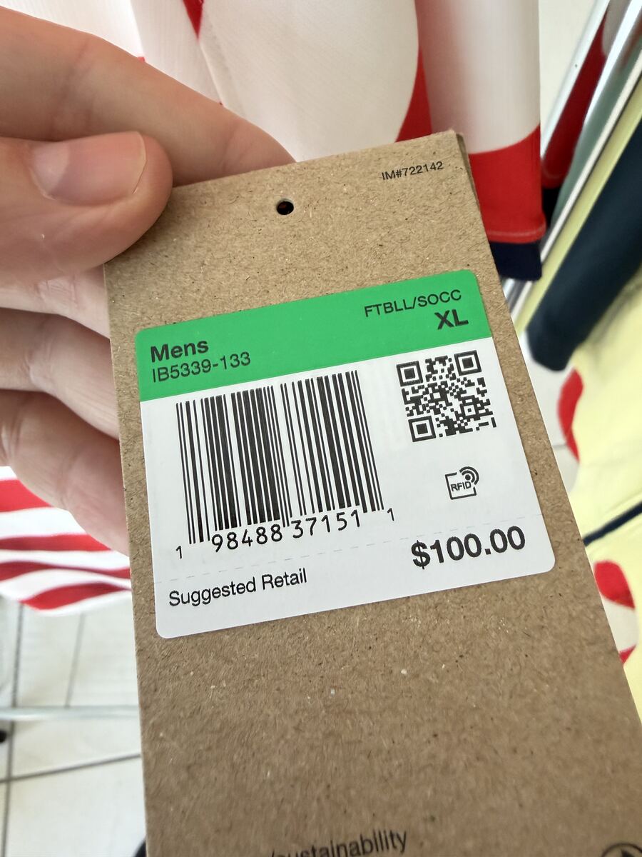 Genuine Nike hangtag with barcode, QR code, RFID icon, and suggested retail price